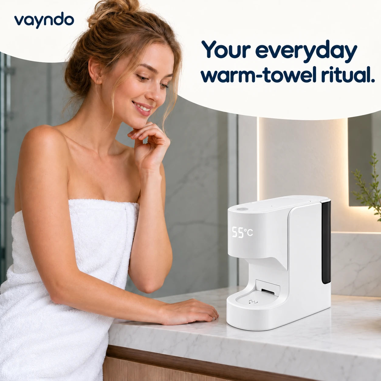 VAYNDO: Your everyday warm-towel ritual. Woman beside the compact dispenser
